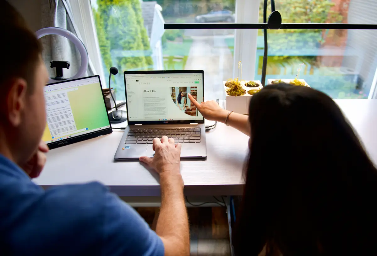 Lee and Elisa Procida working together at their desk